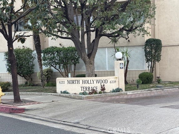 Front view of a multi-story building with signage reading 'North Hollywood Terrace.'