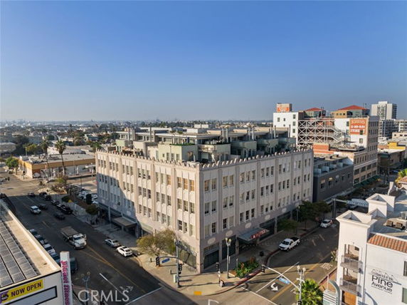 Front view of a multi-story building on a street corner.