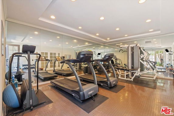 Indoor gym area with treadmills and exercise equipment.