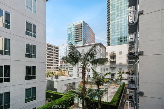 View of a modern apartment complex with multiple high-rise buildings.