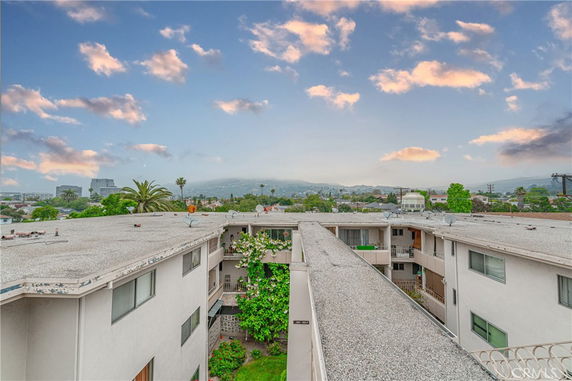 Panoramic view of residential buildings with surrounding landscape.