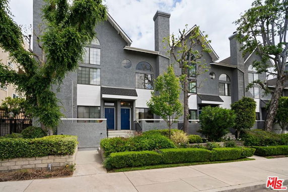 Front view of a multi-story residential building with modern design.