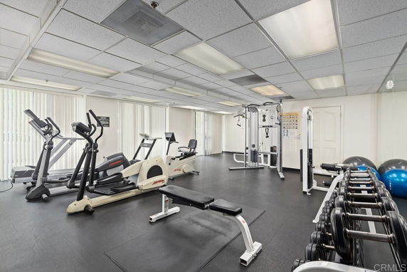 Indoor gym area with various exercise equipment.