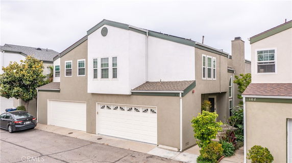 Front view of a two-story house with an attached double garage.