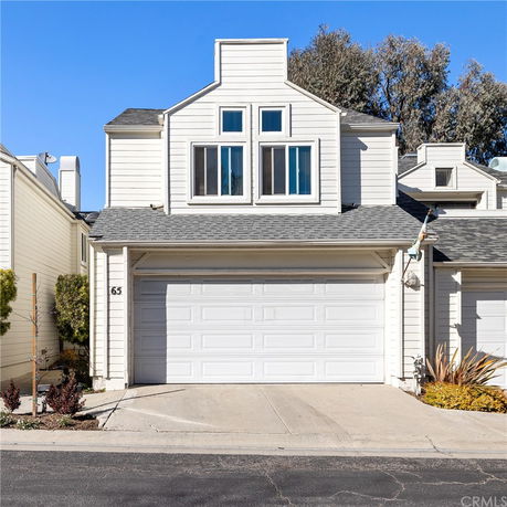 Front view of a two-story house with a double garage.