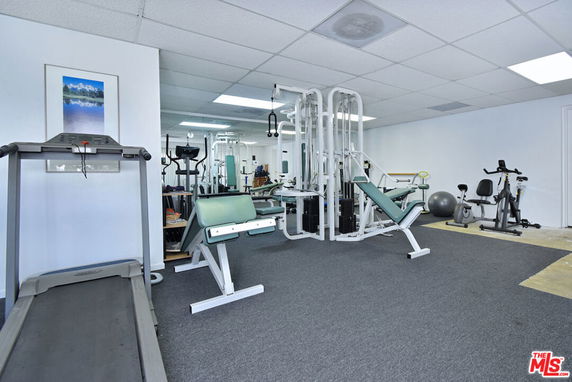 Interior view of a gym room with exercise equipment