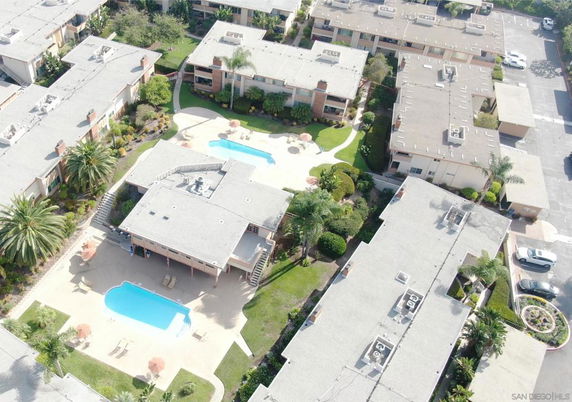 Aerial view of a residential complex with swimming pools.