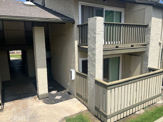 Exterior view of a two-story building with two balconies.