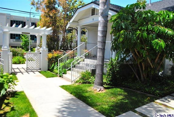 Front view of a house with steps leading to a covered porch.
