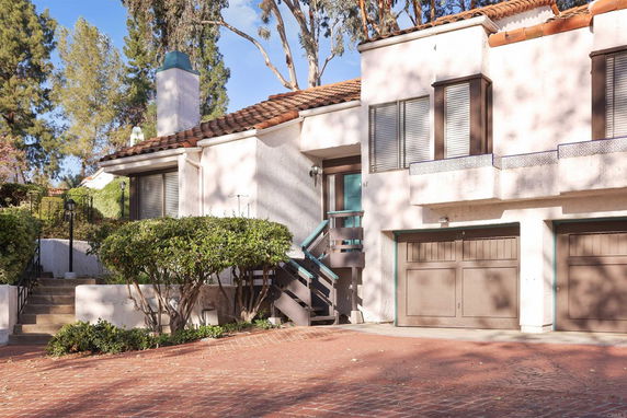 Front view of a multi-story house with a double garage.