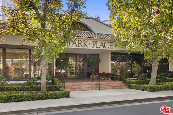Front view of a building entrance with steps and 'Park Place' signage.