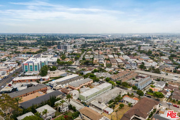 Panoramic view of a cityscape with buildings and roads.