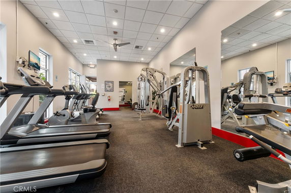 Indoor gym area with treadmills and exercise machines.