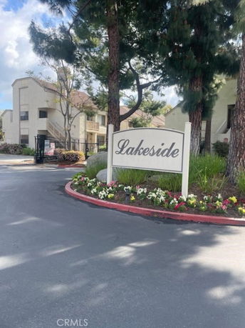 Front view of a residential building complex with a sign reading 'Lakeside'.