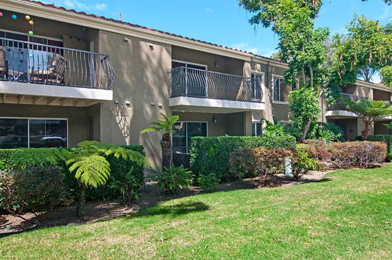 Front view of a two-story residential building with balconies.
