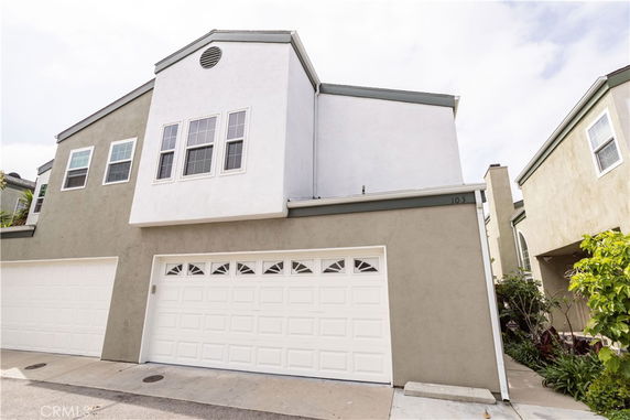 Front view of a two-story house with a double garage.