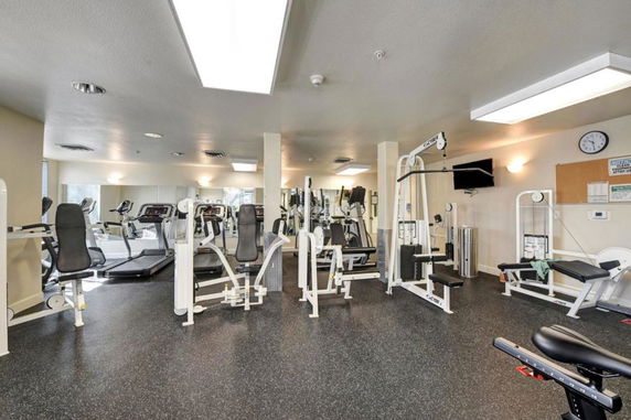 Interior view of a gym with exercise equipment.