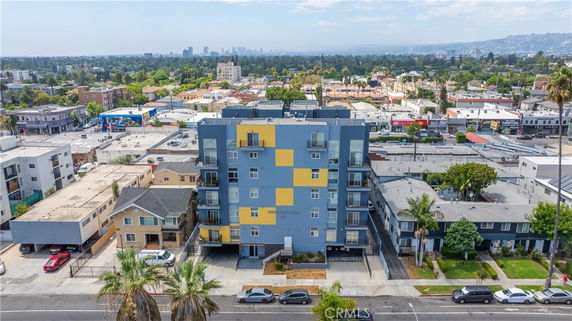 Front view of a multi-story apartment building with a colorful facade.