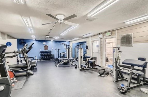 Indoor gym area with various fitness equipment.