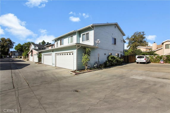 Front view of a two-story house with attached garages.