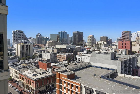 Panoramic view of a cityscape with multiple high-rise buildings.