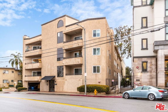 Front view of a multi-story apartment building.