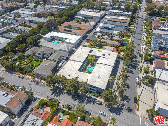 Aerial view of a neighborhood with residential houses and buildings.
