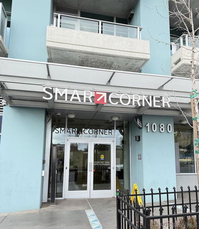 Front view of a building with a sign reading 'Smar Corner' and the number '1080' at the entrance.