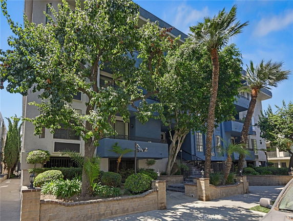 Front view of a multi-story residential building with a modern design.