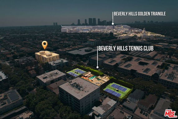 Aerial view of a cityscape with buildings and tennis courts.