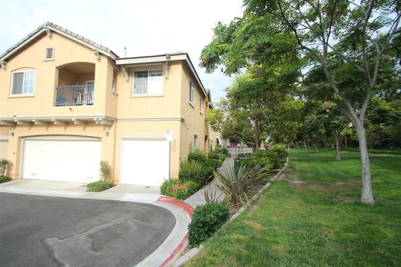 Front view of a two-story house with a double garage.