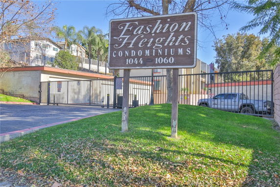 Front view of a condominium complex with a gated entrance.