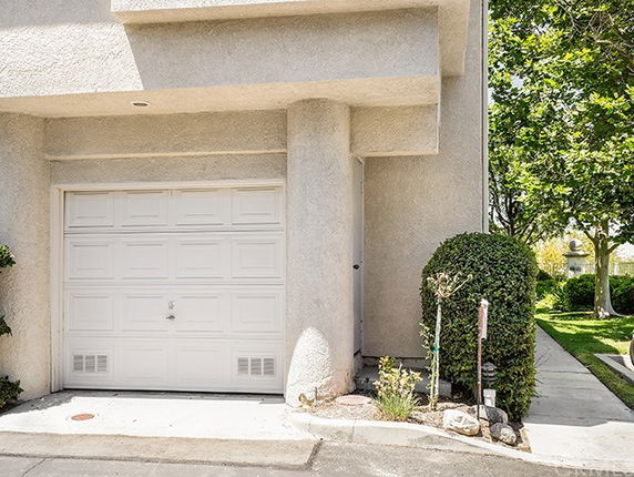Front view of a building with a single garage.