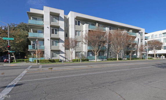 Front view of a modern multi-story apartment building.