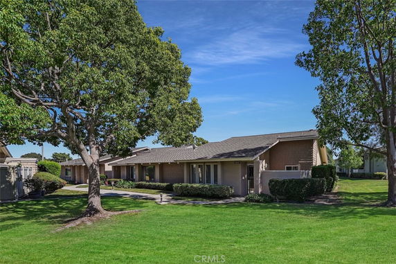 Front view of a single-story house with a sloped roof.