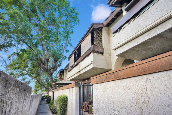Angled view of a multi-story building with balconies.
