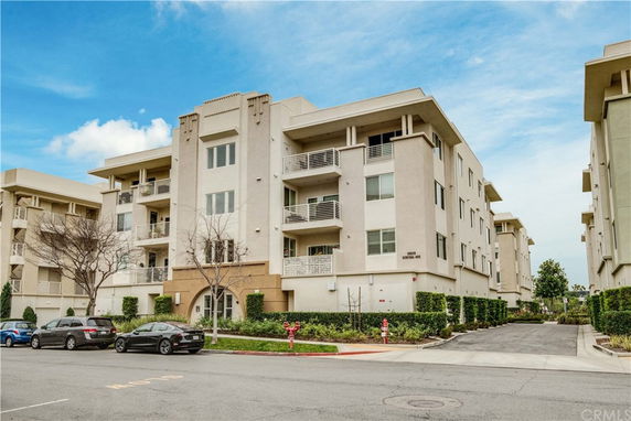 Front view of a multi-story apartment building.