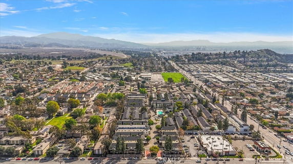 Panoramic view of a residential area with a mix of houses and green spaces.