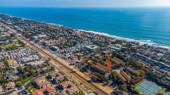 Aerial view of coastal town with buildings and ocean.