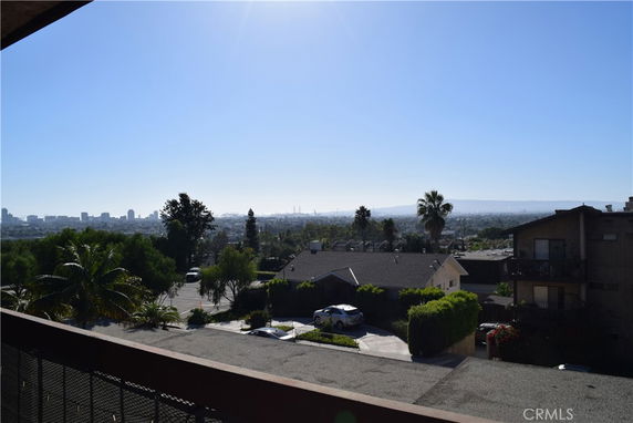 Panoramic view from a building, showcasing surrounding area and city skyline.