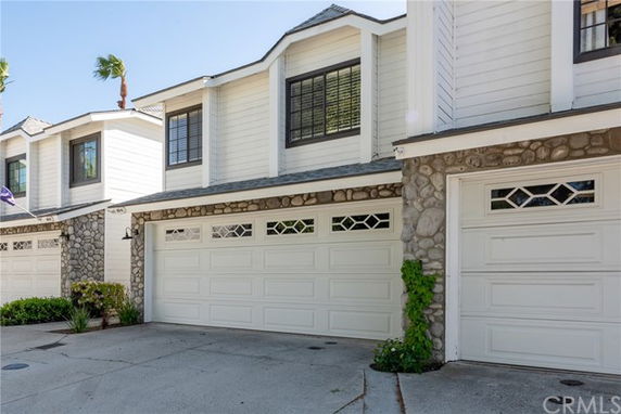 Front view of a two-story house with a double garage.