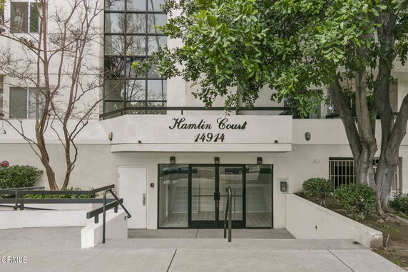 Front view of a multi-story building entrance named Hamlin Court.