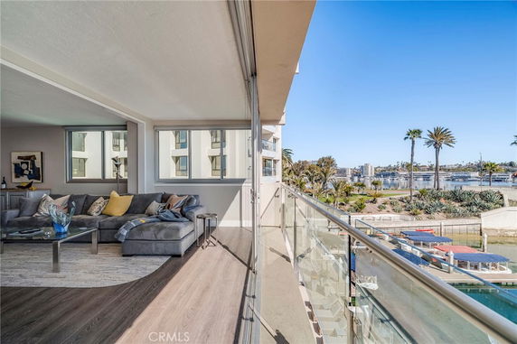 Panoramic view from a building showing waterfront and palm trees