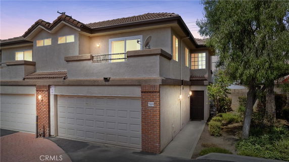 Front view of a two-story house with a double garage.