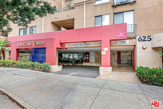 Front view of a multi-story building with a prominent entrance.