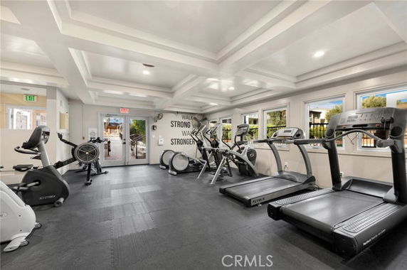Indoor gym area with exercise machines and treadmills.