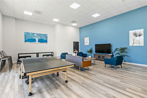 Recreation room with a table tennis setup and seating area