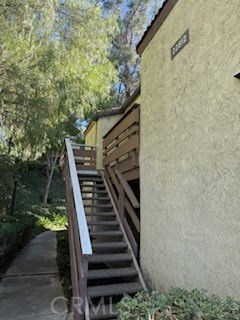 Front view of a building with an outdoor staircase.