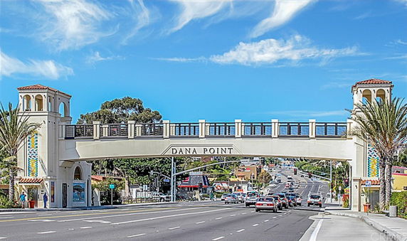 Front view of a decorative bridge labeled 'DANA POINT' over a road.