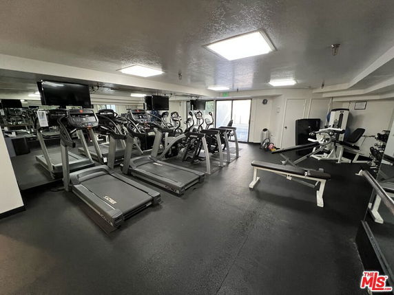Indoor gym room with treadmills and fitness equipment.